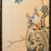 A Chinese painting with two embroidered images of colourful birds.
